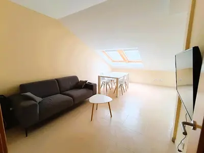 a living room with a couch and a table at La Favorita de Cabanas in Cabañas