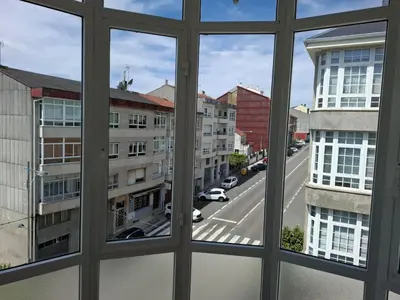 a view of a city street from a window at Road in Palas de Rei