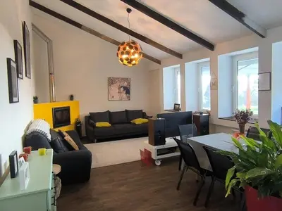 a living room with a couch and a table at Relax & Vistas, casa en la roca in Rogüela