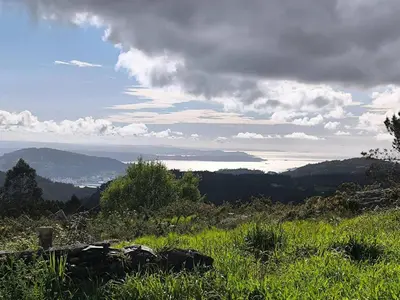 a view of the ocean from a field of grass at Relax & Vistas, casa en la roca in Rogüela