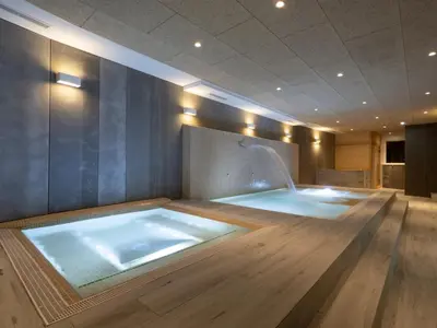 a jacuzzi tub in the middle of a room at Pensión Spa Cruceiro de Pedrouzo in O Pedrouzo