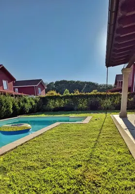 a swimming pool in the yard of a house at Casa con piscina Riosar Santiago in Amés