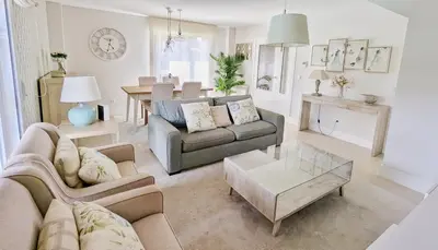 a living room with a couch and a table at Casa con piscina Riosar Santiago in Amés