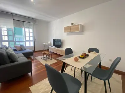 a living room with a table and a couch at A dos Pasos in Caldas de Reis