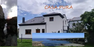 a white house with the words casa pura at Casa Pura in Ribadeo