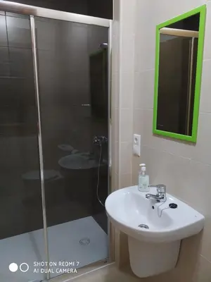 a bathroom with a shower and a sink and a shower at Casa Pura in Ribadeo