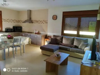 a living room with a couch and a table at Casa Pura in Ribadeo