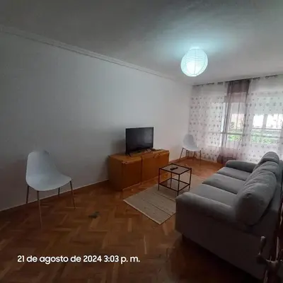 a living room with a couch and a tv at Entire apartment centro ponferrada in Ponferrada