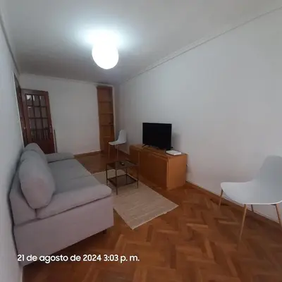 a living room with a couch and a tv at Entire apartment centro ponferrada in Ponferrada
