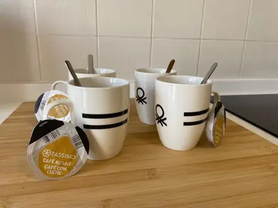a group of four coffee mugs sitting on a table at A un Paso in Caldas de Reis