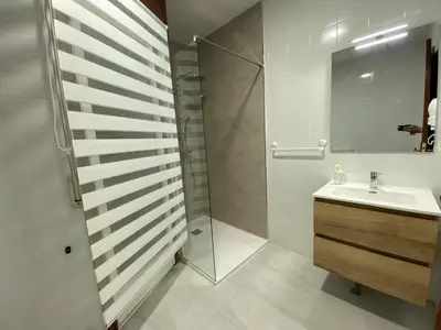 a bathroom with a shower and a sink at A tres Pasos in Caldas de Reis