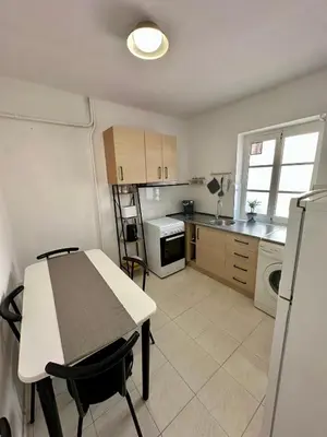 a kitchen with a table and a counter top at Alojamientos El Bierzo in Ponferrada
