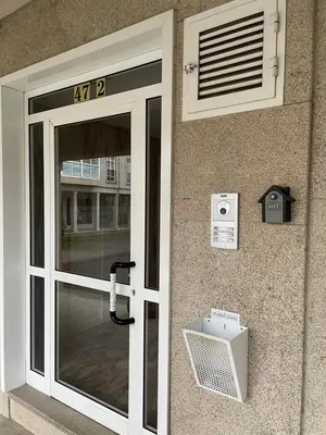 a door to a building with a sign on it at Destino Allariz in Allariz