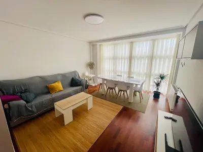 a living room with a couch and a table at Destino Allariz in Allariz