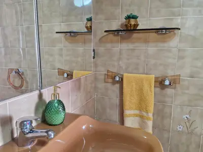 a bathroom with a sink and a mirror at Casa Caldelas in Puente Caldelas