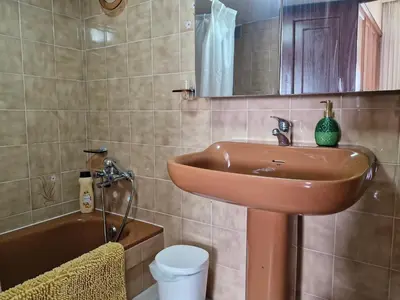 a bathroom with a sink and a tub at Casa Caldelas in Puente Caldelas