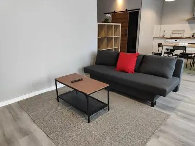 a living room with a couch and a coffee table at Lar de Yago - Apto Barreiros B in San Cosme de Barreiros