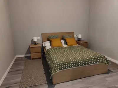 a bedroom with a bed with yellow pillows at Lar de Yago - Apto Barreiros B in San Cosme de Barreiros
