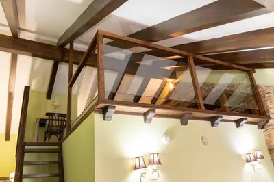 a loft conversion with a staircase in a room at Apartamentos Turisticos A Estacion in A Pontenova