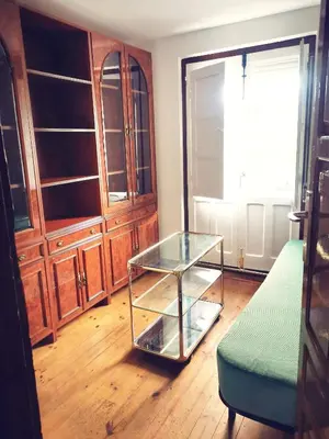 a living room with a glass table and a couch at Apartamento MIZA in Ponferrada