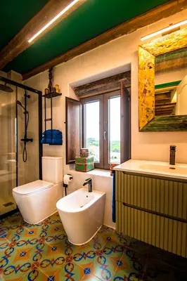 a bathroom with a tub and a toilet and a sink at Casa Rural zona Playa de Frejulfe in Piñera