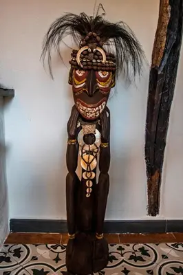 a wooden statue of a person wearing a mask at Casa Rural zona Playa de Frejulfe in Piñera