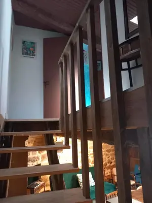 a wooden staircase in a house with a room at A casa da Touza in Pensos