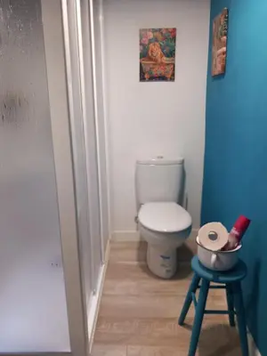a small bathroom with a toilet and a stool at A casa da Touza in Pensos