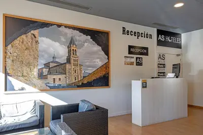 a large painting of a church on a wall at AS Hoteles Ponferrada in Columbrianos