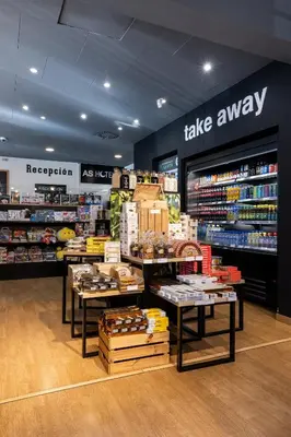 a store with two tables in a store with books and other products at AS Hoteles Ponferrada in Columbrianos