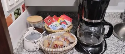a kitchen counter with two baskets and a blender at La Vega De Somiedo 2 in Pola de Somiedo