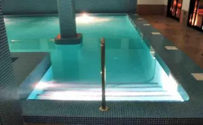 a swimming pool with a pole in the water at Apartment in Costa with Spa, Jacuzzi in San Miguel de Reinante