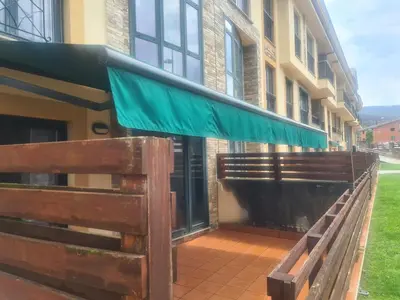 a green awning on the side of a building at Apartment in Costa with Spa, Jacuzzi in San Miguel de Reinante