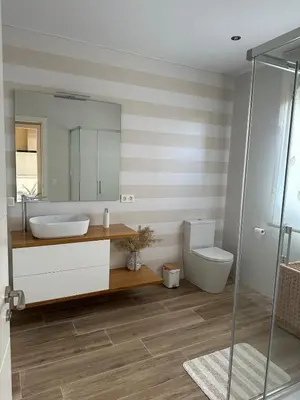 a bathroom with a sink and a toilet at Villa Doce in Puentecesures