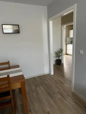 a white room with a table and a dining room at Villa Doce in Puentecesures