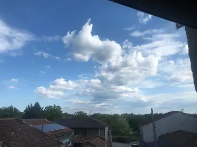 a blue sky with white clouds in the sky at A Castelana de Cea in Cea