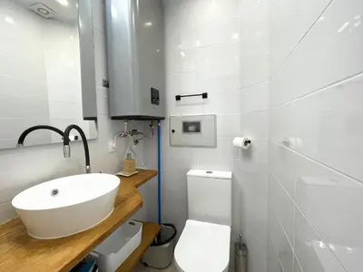 a white bathroom with a sink and a toilet at housingcoruña BASTIAGUEIRO in Bastiagueiro