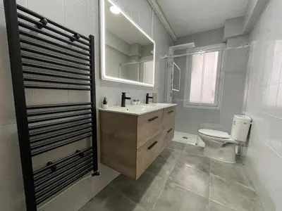 a bathroom with a sink and a toilet and a mirror at El Bierzo - Ponferrada in Ponferrada