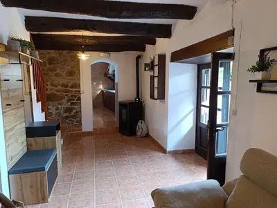 a hallway in a house with a living room at Finca el Filandón in San Miguel de Arganza