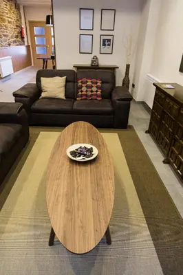 a living room with a table and a couch at Casa Baran in Sarria