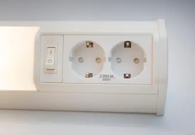 an electrical outlet with three lights on it at Albergue Spa Cruceiro de Pedrouzo in O Pedrouzo