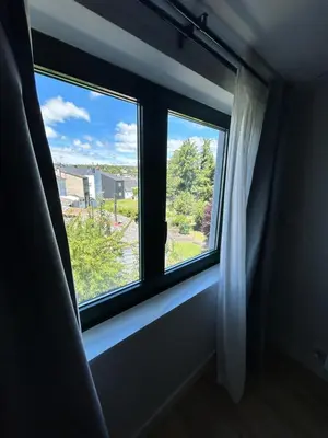 a window in a room with a window sill at Pensión do Catro in Puebla de Trives