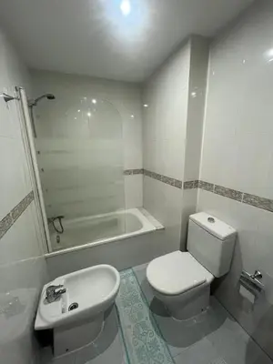 a bathroom with a toilet and a sink and a tub at As Marismas - Miño in Miño