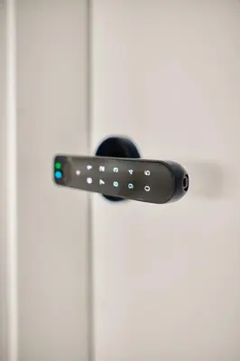 a black door handle on a white door at AHH Atlantic Horizon Homes in Oleiros