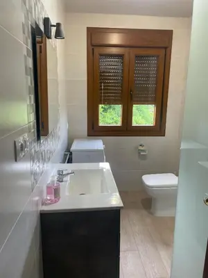 a bathroom with a sink and a toilet at Casa do Carpinteiro in Brocos
