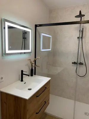 a bathroom with a sink and a shower at Apartamento Playa de Foz in Foz