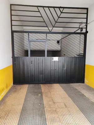 a gym with a basketball hoop in a garage at Apartamento Rosalía de Castro Ribadeo in Ribadeo