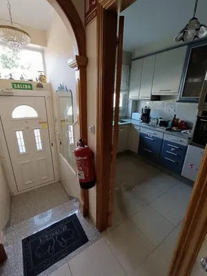 a bathroom with a toilet and a sink and a shower at Albergue Ultreia Sigueiro in Sigüeiro