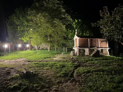 a small house in a field at night at Casa Castro in Lamas