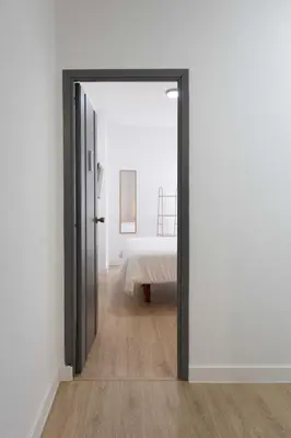 an open door into a bedroom with a bed at Habitación en Apartamento Teo in Santiago de Compostela